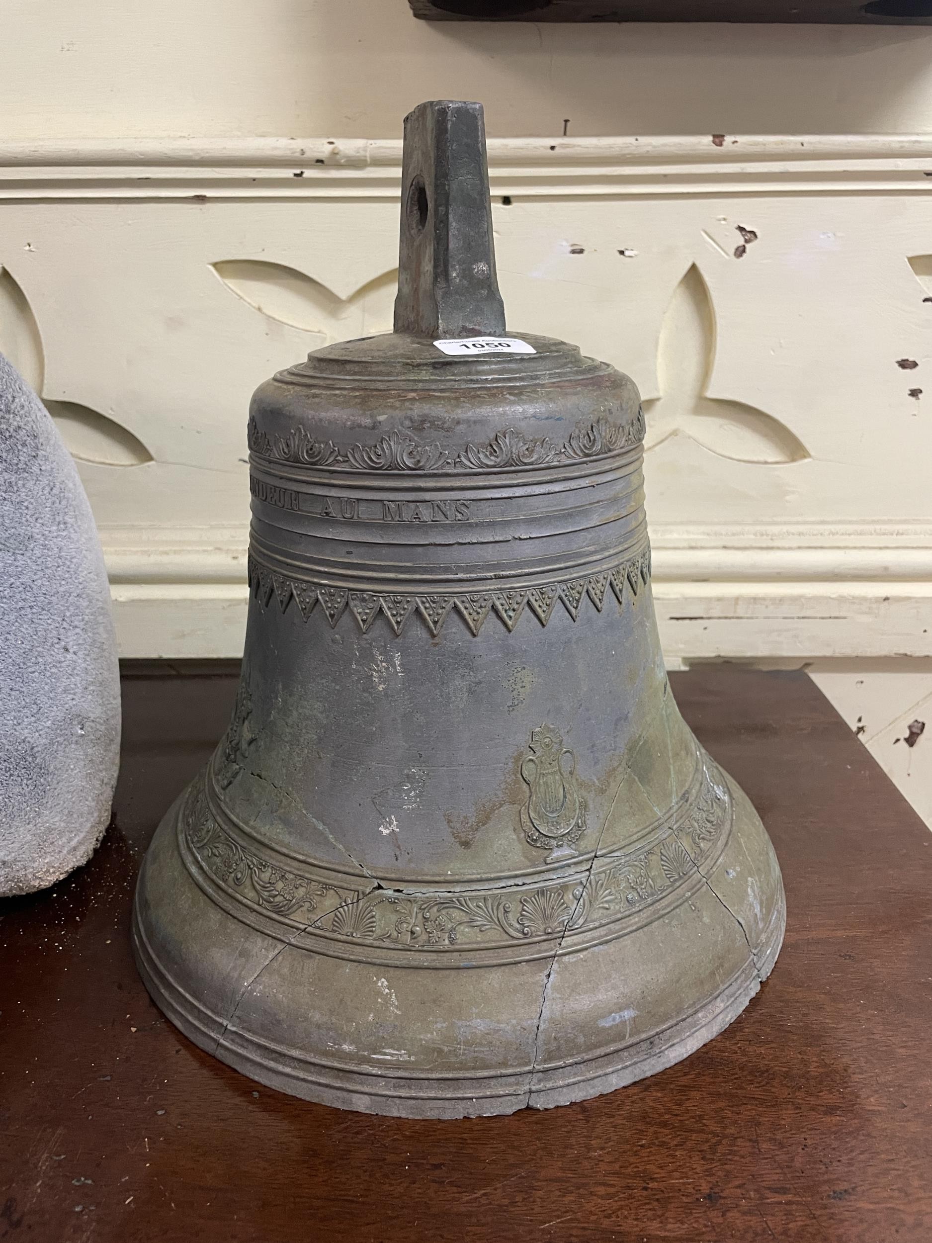 A bronze bell, 22 cm diameter Heavily repaired