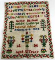 A Victorian sampler, signed Gertie Barlow of Kirkby Landthorpe National School, aged 12 years old,