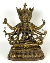 A gilt metal Buddha, 33 cm high
