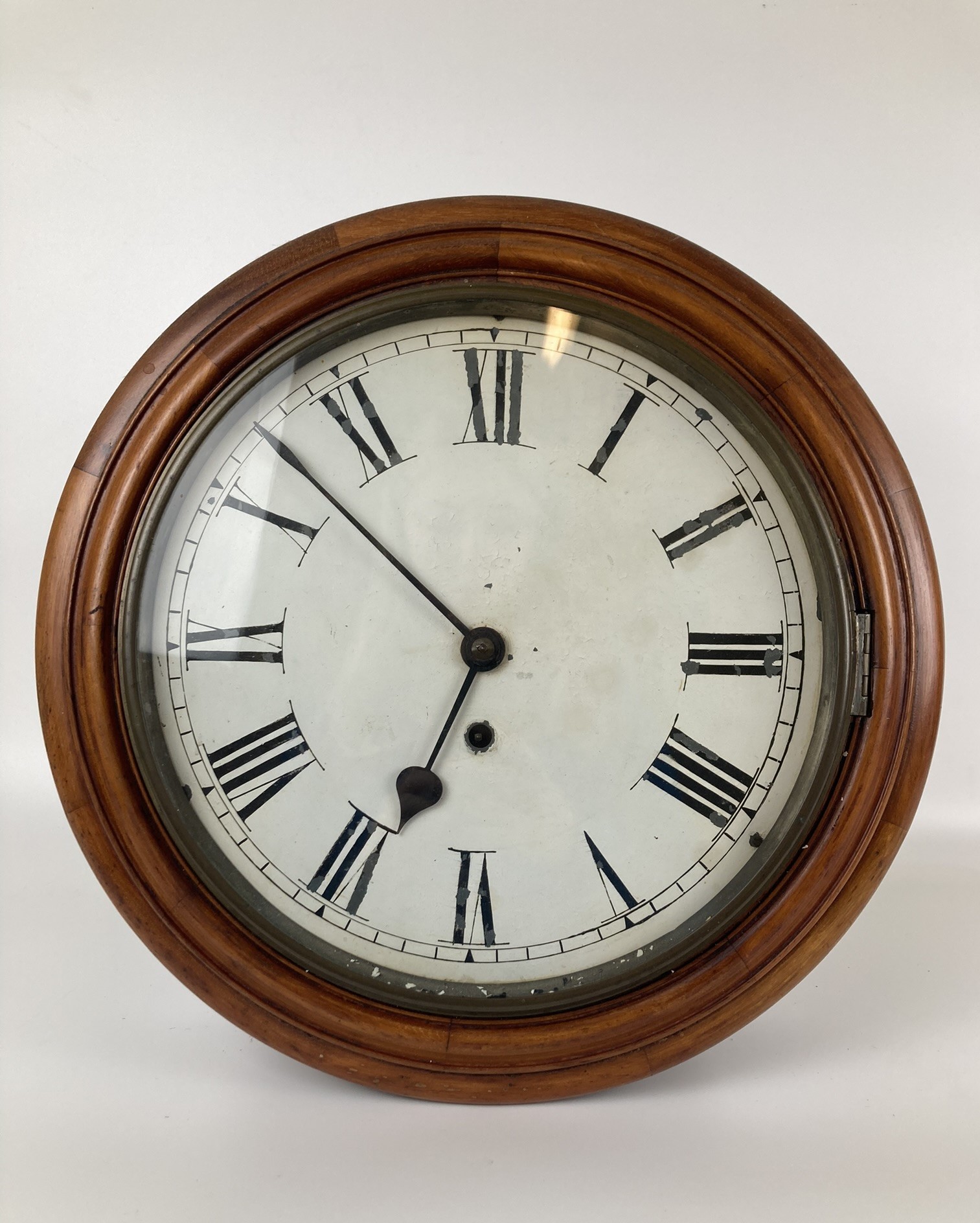 A wall clock, in a mahogany case, 40 cm diameter