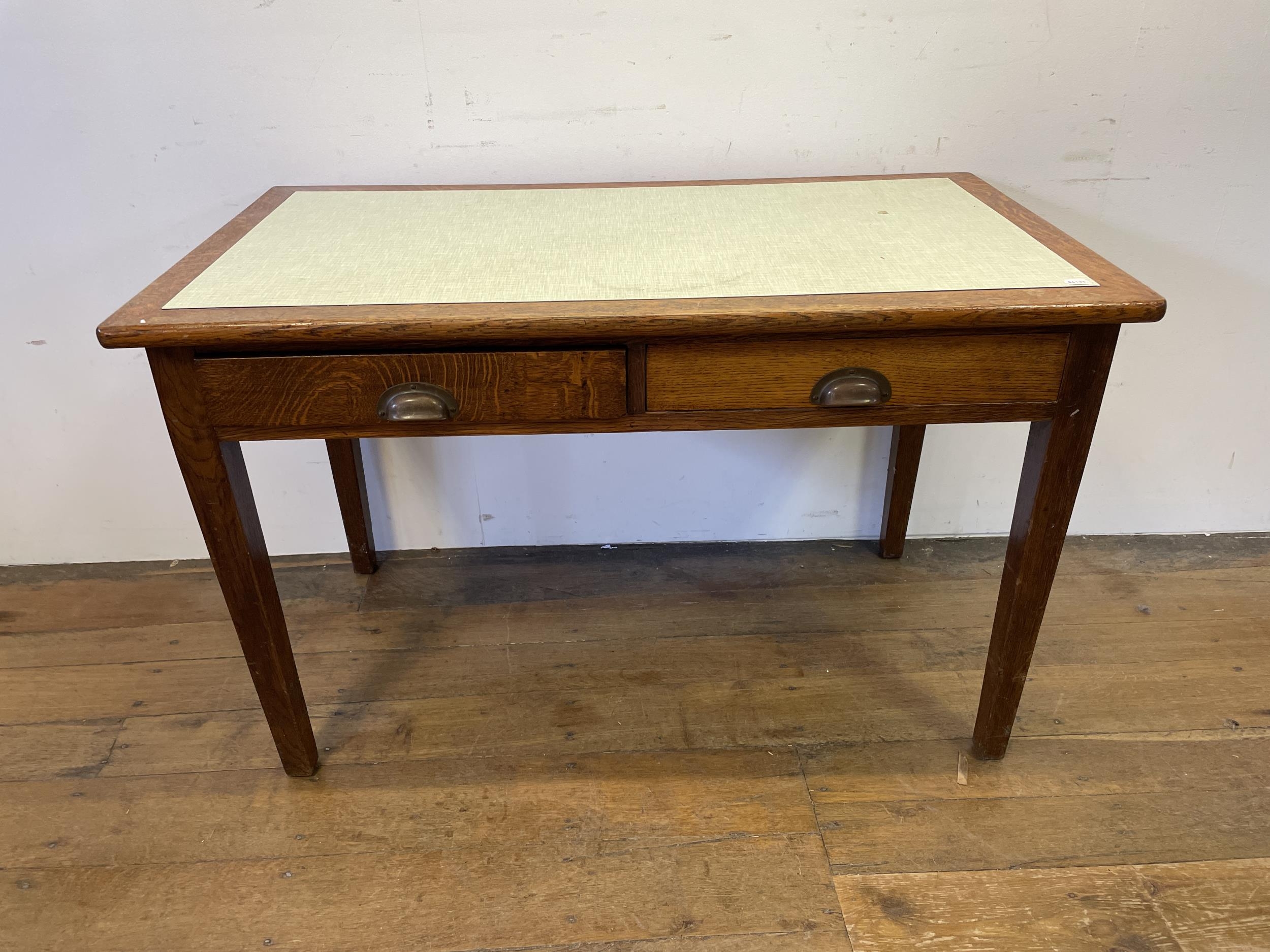 An oak desk, 122 cm wide
