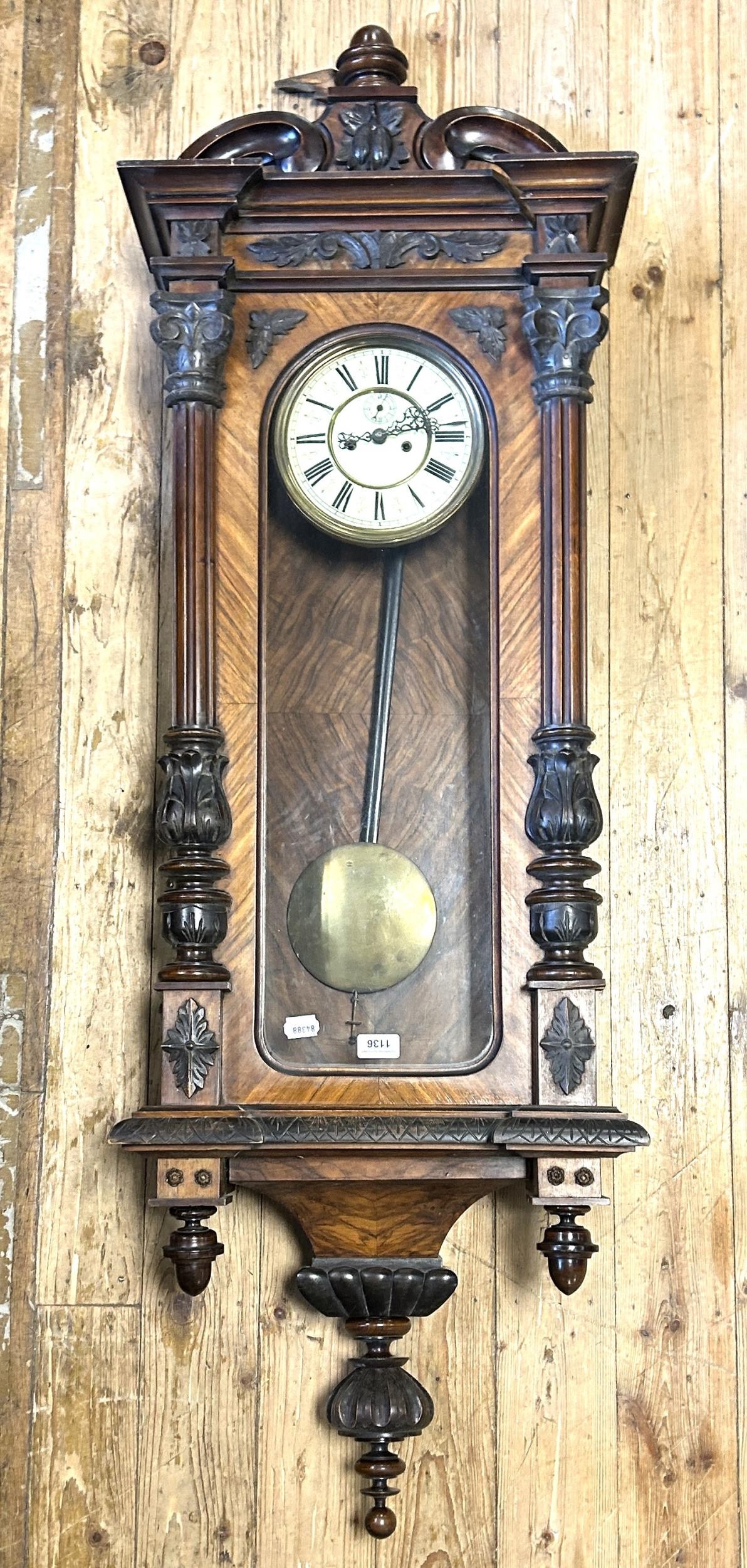 A Vienna regulator style wall clock, in a walnut case, 152 cm