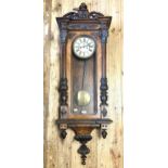 A Vienna regulator style wall clock, in a walnut case, 152 cm