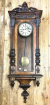 A Vienna regulator style wall clock, in a walnut case, 152 cm