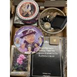 An Elizabeth II silver photograph frame, assorted Queen Elizabeth II commemorative items, and