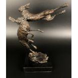 ***Withdrawn*** A bronze group,  of two hares boxing, on a polished slate base, 24 cm high