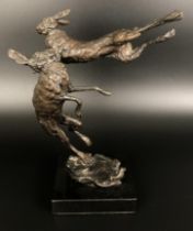 ***Withdrawn*** A bronze group,  of two hares boxing, on a polished slate base, 24 cm high