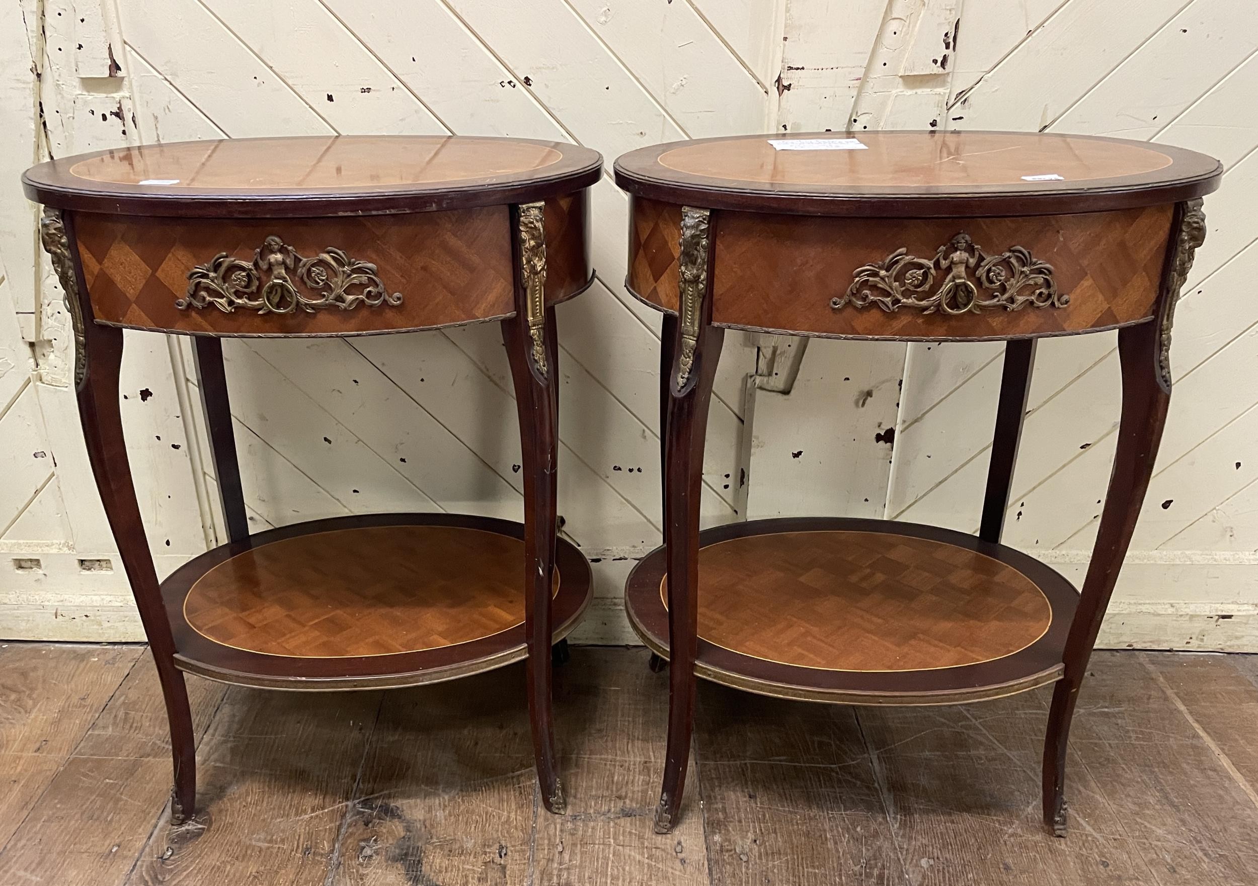 A pair of French style oval two tier tables, 60 cm wide (2)