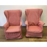 A pair of Parker Knoll type wingback armchairs, another, a mirror, a two tier trolley, a two tier