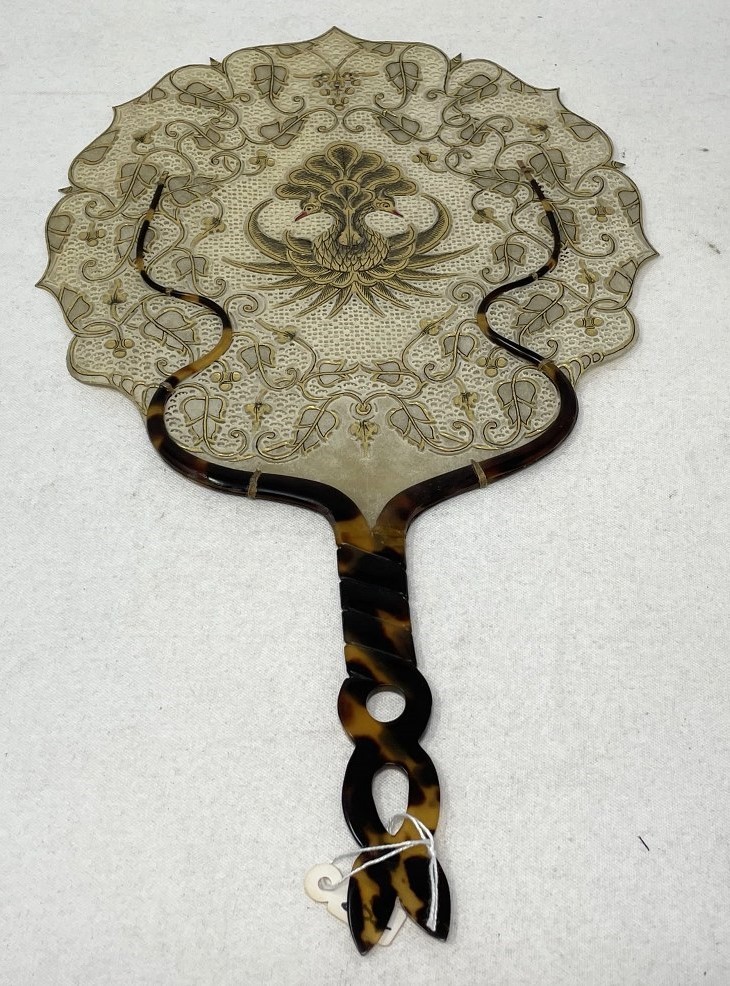 A horn fan, the skin pierced and decorated birds and foliate forms, 31 cm