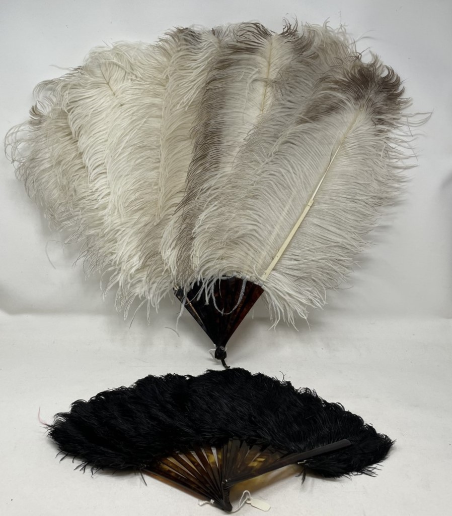A bakelite and feather fan, 48 cm, and three other feather fans (4)