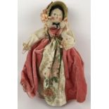 A Grodnertal style painted wooden doll, 30 cm Provenance: Sold on behalf of SNCBS