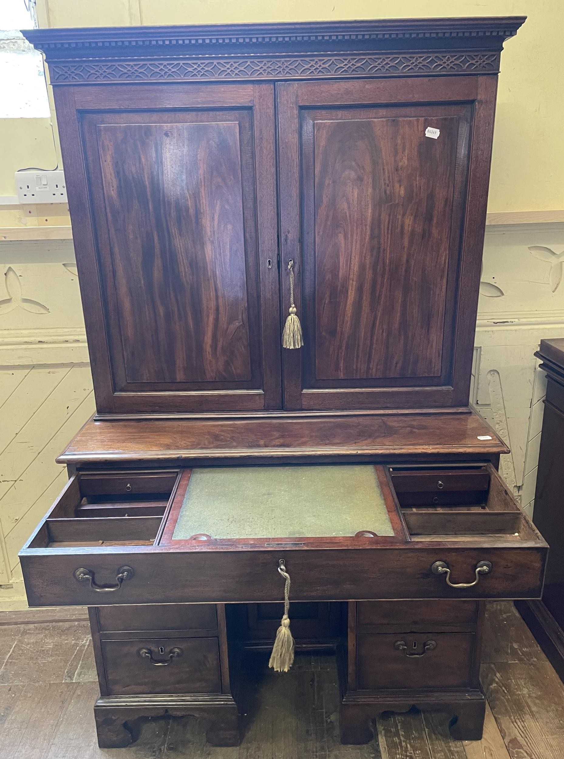 A 19th century mahogany kneehole desk, with a bookcase top having a pair of panel doors, opening - Image 3 of 9