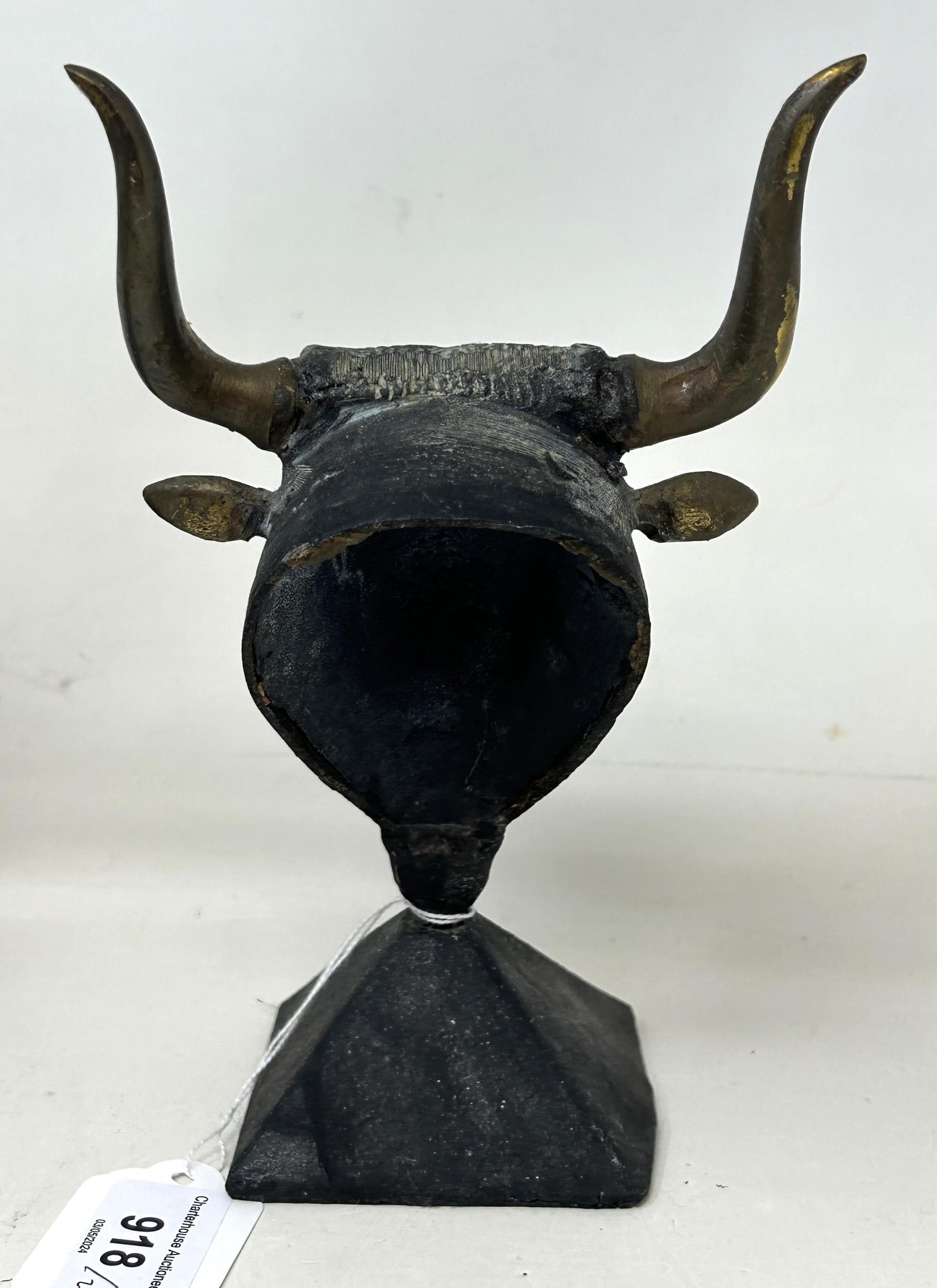 An Egyptian style Sphinx, 25 cm wide, and a figure of a bull's head (2) - Image 4 of 6