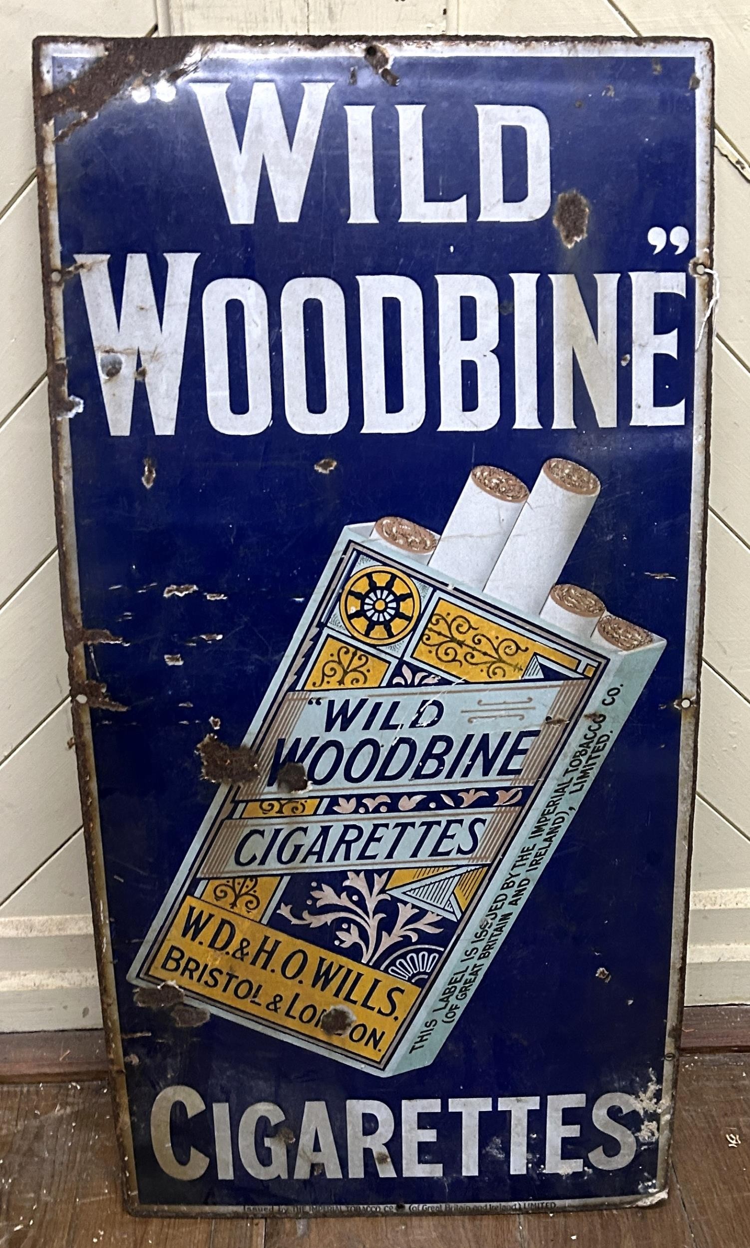 An enamel sign, Wild Woodbine Cigarettes, 95 x 46 cm