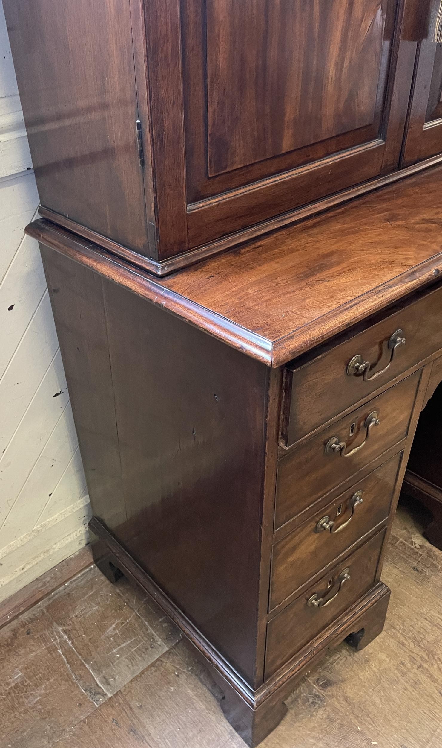 A 19th century mahogany kneehole desk, with a bookcase top having a pair of panel doors, opening - Image 7 of 9