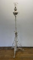 A painted wrought iron standard lamp, 160 cm high