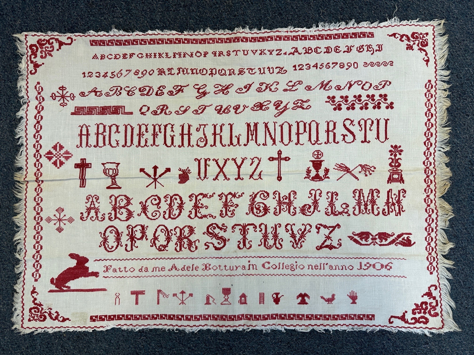 An early 20th century sampler, signed Adele Botturain, dated 1906, 39 x 57 cm