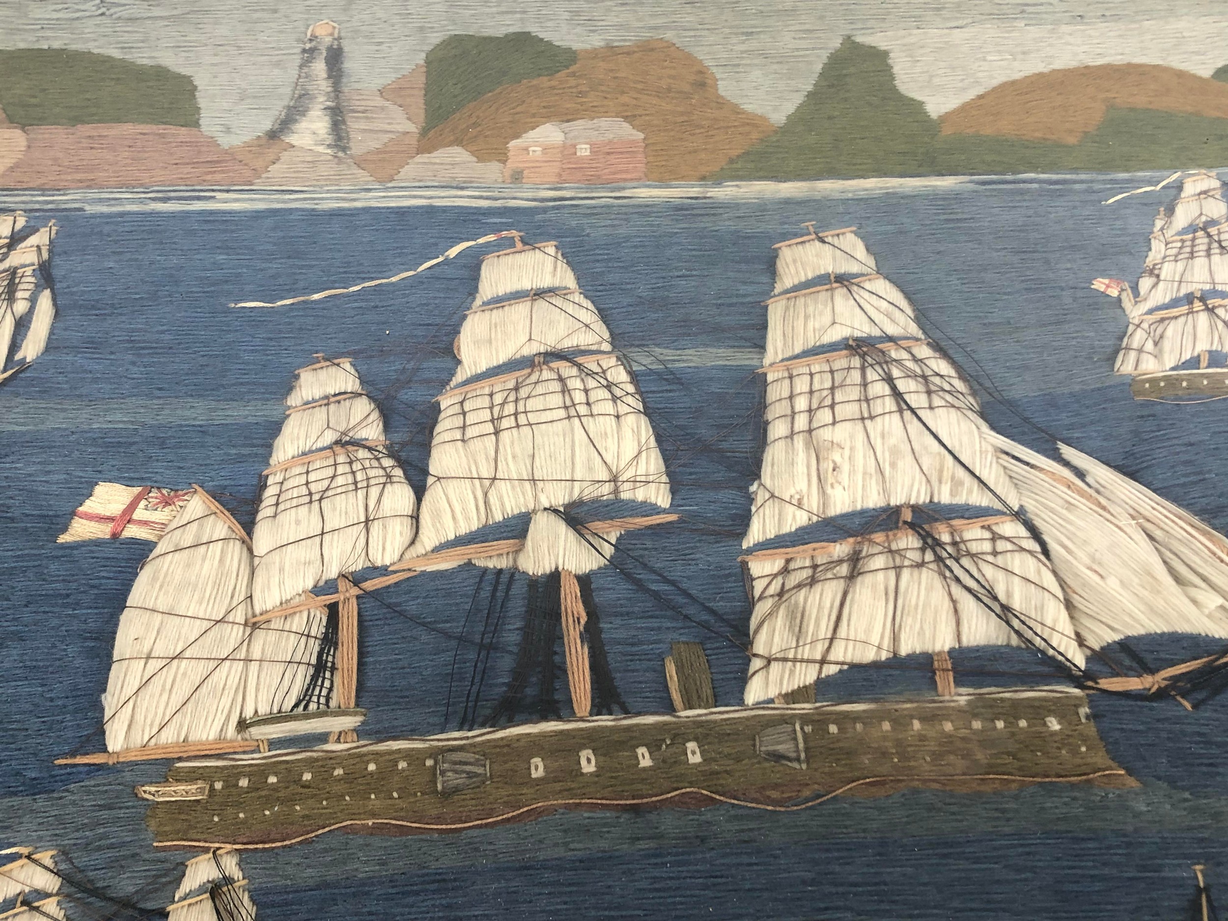 A Victorian sailor woolwork panel, decorated steam and other ships, with a lighthouse in the - Image 2 of 3