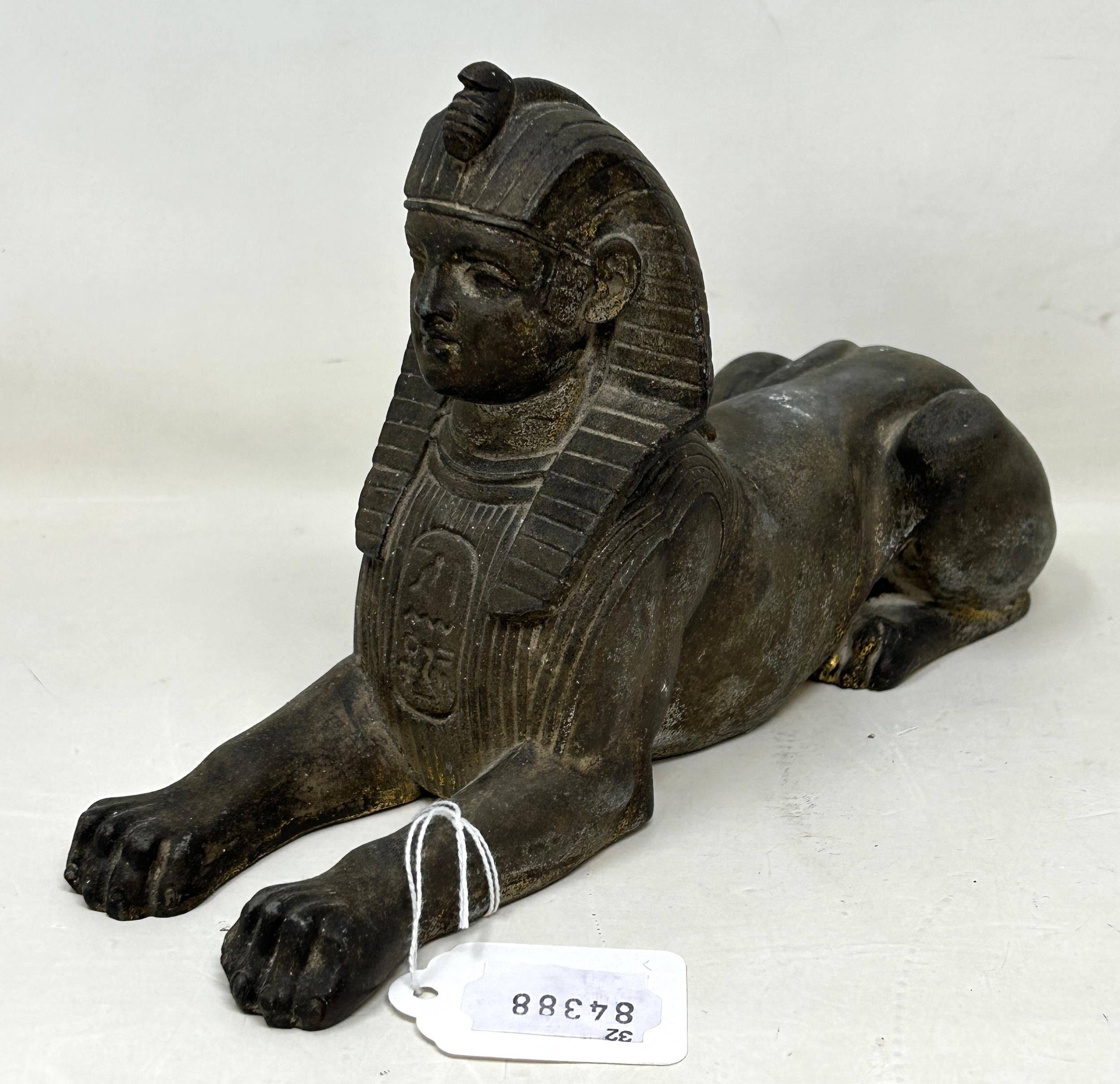 An Egyptian style Sphinx, 25 cm wide, and a figure of a bull's head (2) - Image 2 of 6