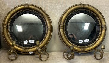 A pair of 19th century convex girandoles, 41 cm diameter (2)