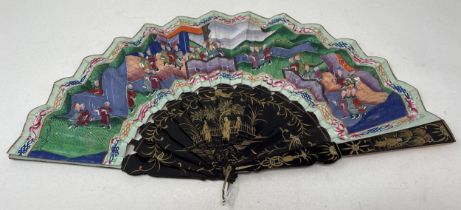 A Chinese lacquered fan, decorated figures, paper painted interior scene, 9.5 cm