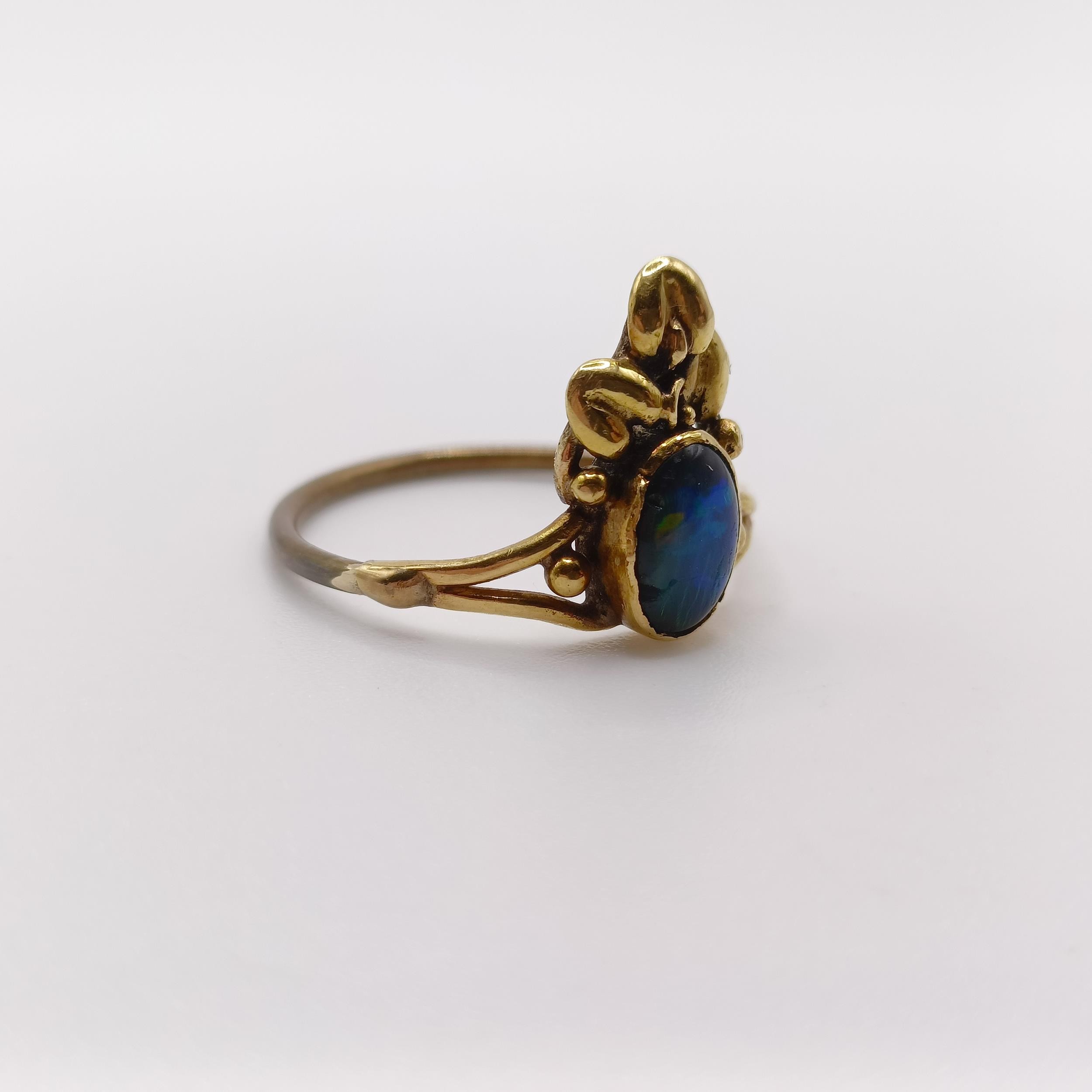 An Arts and Crafts yellow coloured metal and opal ring, by Jean Bassett, size J 1/2 Provenance: - Image 3 of 6