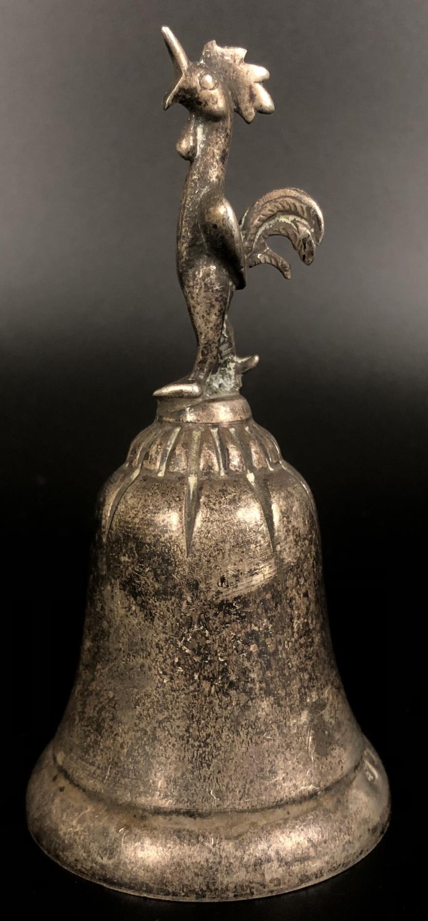 A Continental silver coloured metal bell, with a cockerel finial, 14 cm high 60 g
