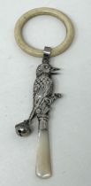 ***Withdrawn*** A silver and mother of pearl baby's rattle, in the form of a bird, Birmingham