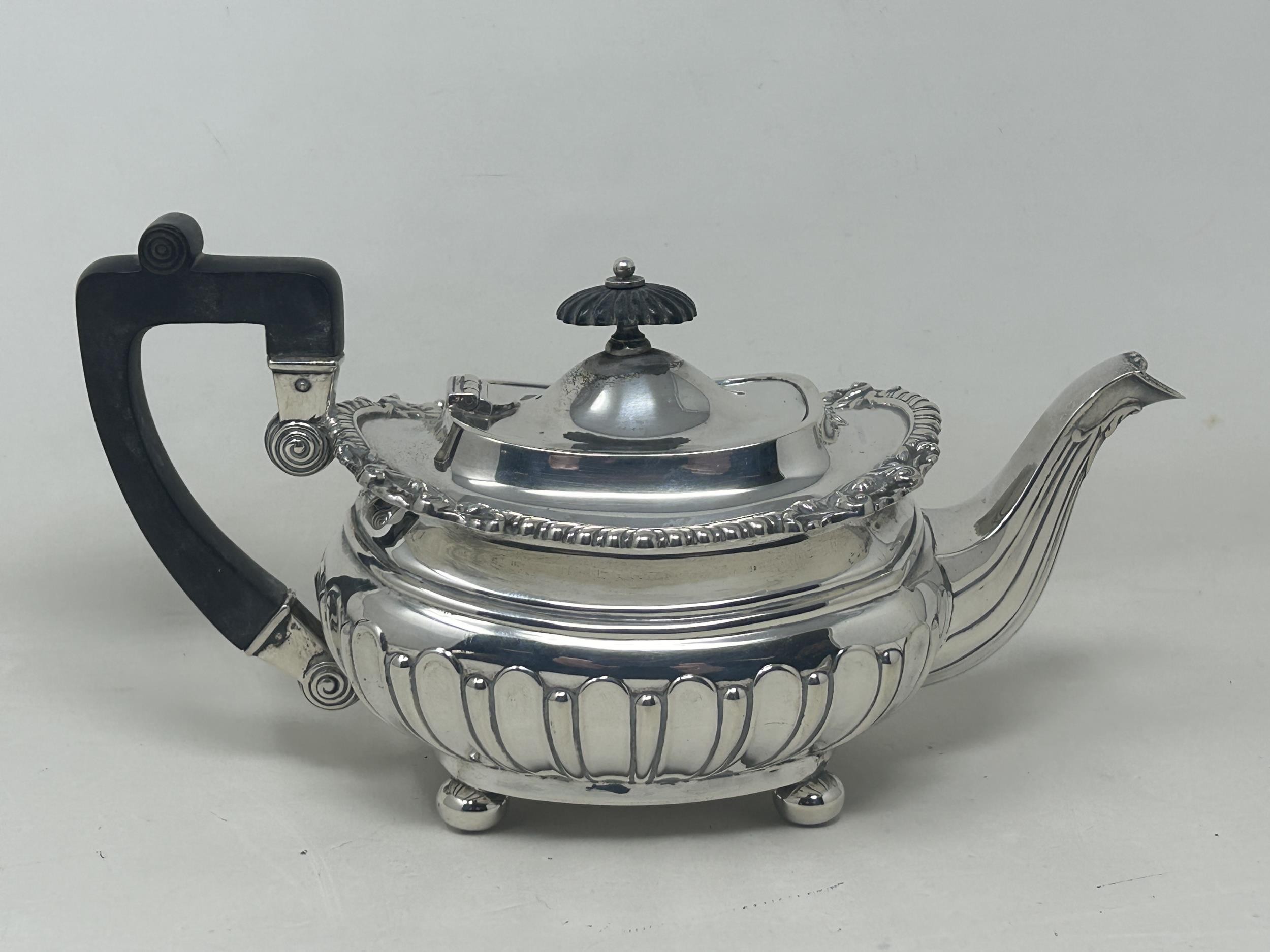 A George V silver bachelor teapot with an ebonised handle, and matching sugar bowl, London 1909, all - Bild 7 aus 11