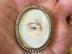 A lover's eye brooch, in a yellow coloured metal and seed pearl mount, 4 x 3 cm Ivory Exemption