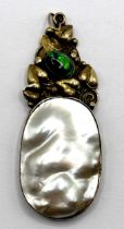 An Arts and Crafts yellow coloured metal, shell and green stone pendant, by Jean Bassett, 5 cm