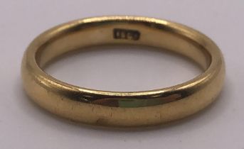 A 18ct gold wedding band, ring size P, 5.9 g