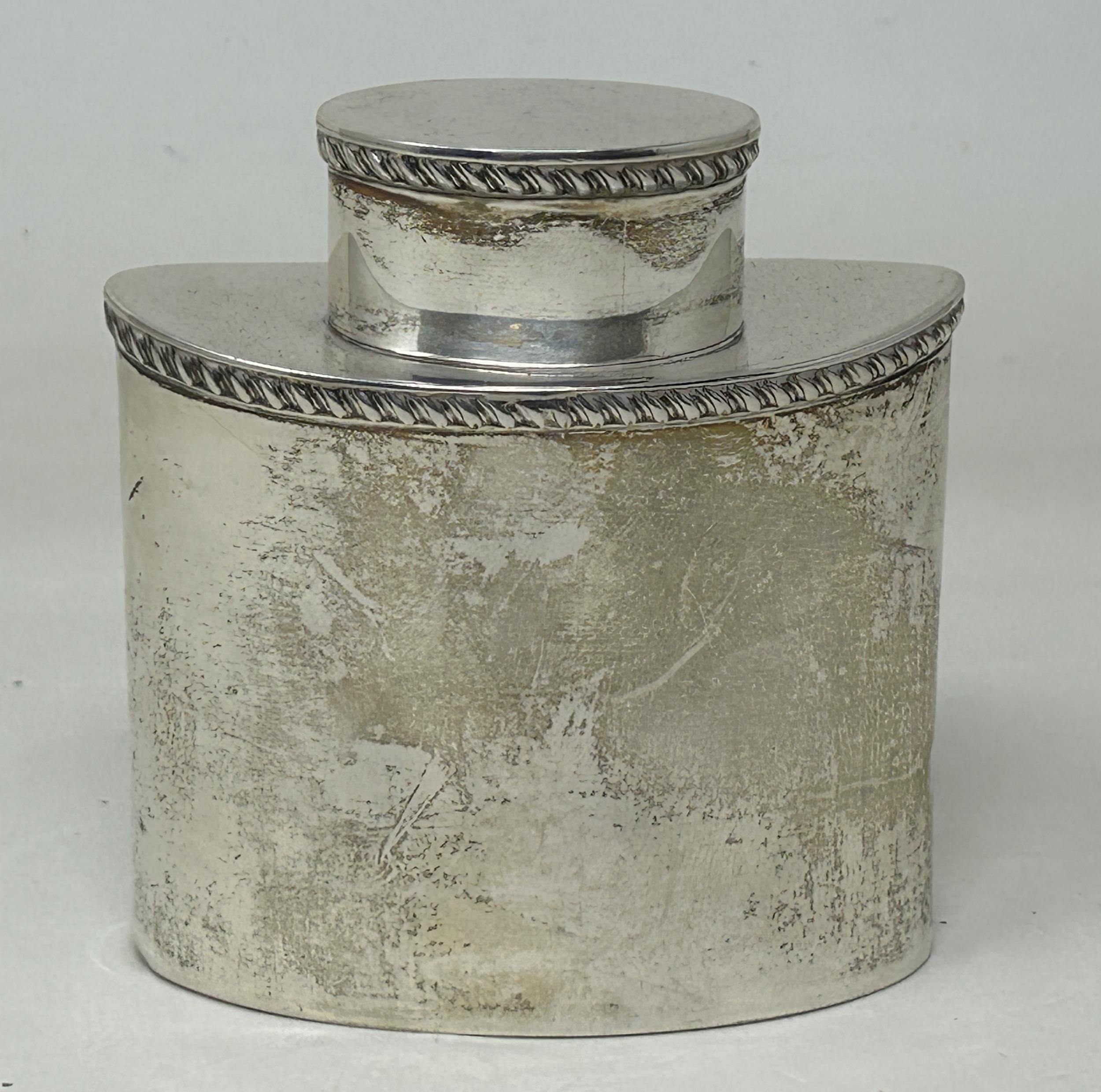 An Edward VII silver oval caddy, London 1905, 3.7 ozt