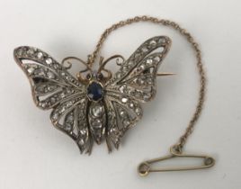 A late 19th/early 20th century diamond, sapphire and red stone brooch, in the form of a butterfly