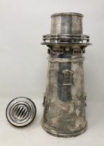 A large novelty silver cocktail shaker, in the form of a lighthouse, 37 cm high