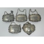 A set of four Elizabeth II silver spirit labels, Port, Gin, Sherry and Scotch, London 1970, and a