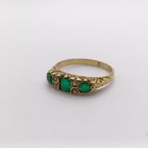 An 18ct gold, emerald and diamond ring, ring size O weight: 2.7 g all in marks rubbed, central