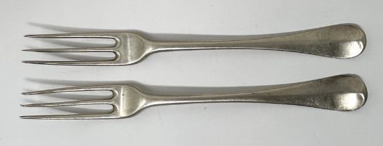 A pair of George I silver Old English pattern three pronged forks, London 1724, 3.6 ozt