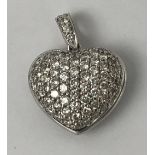 An 18ct gold and diamond heart shaped pendant