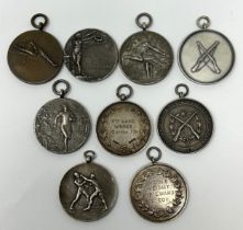 Seven silver sporting medallions, and two others, (9) weighable silver: 3.9 ozt all in