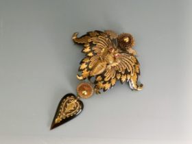 A large Victorian yellow coloured metal and tortoiseshell brooch, in the form of a butterfly, in a