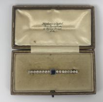 An Art Deco sapphire and diamond bar brooch, in a vintage jewellery box Sapphire untested weight: