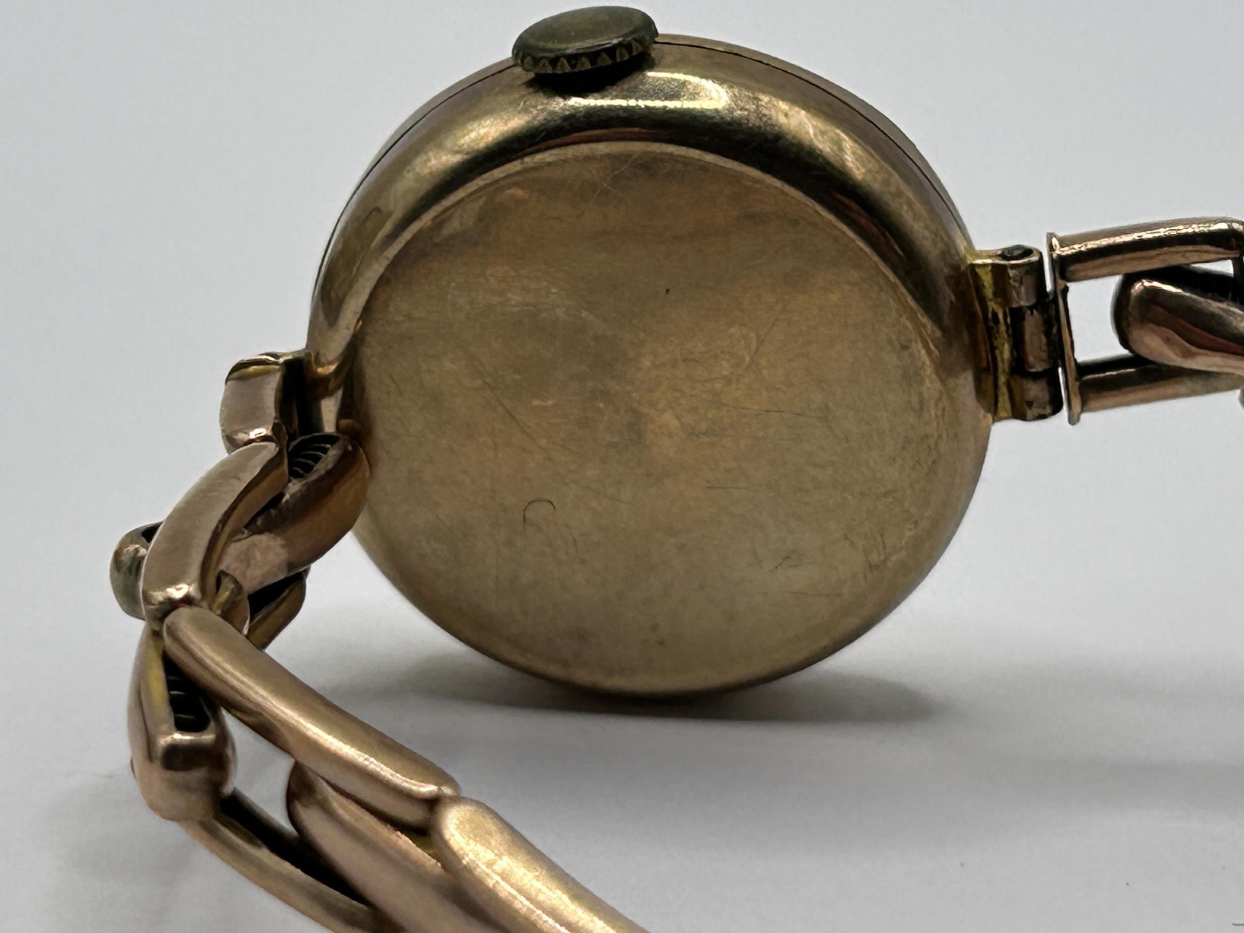 A ladies yellow coloured metal wristwatch, on a silk strap, with a worn vintage watch box, and a - Image 6 of 6