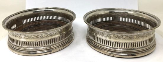 A pair of George III silver and mahogany bottle coasters, Robert Hennell, London 1812 Provenance: