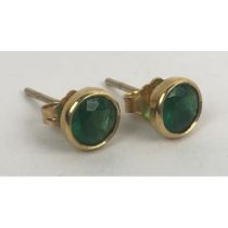 A pair of 18ct gold emerald stud earrings