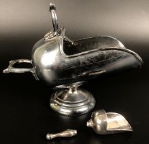 A silver plated sugar hod, in the form of a coal helmet with shovel