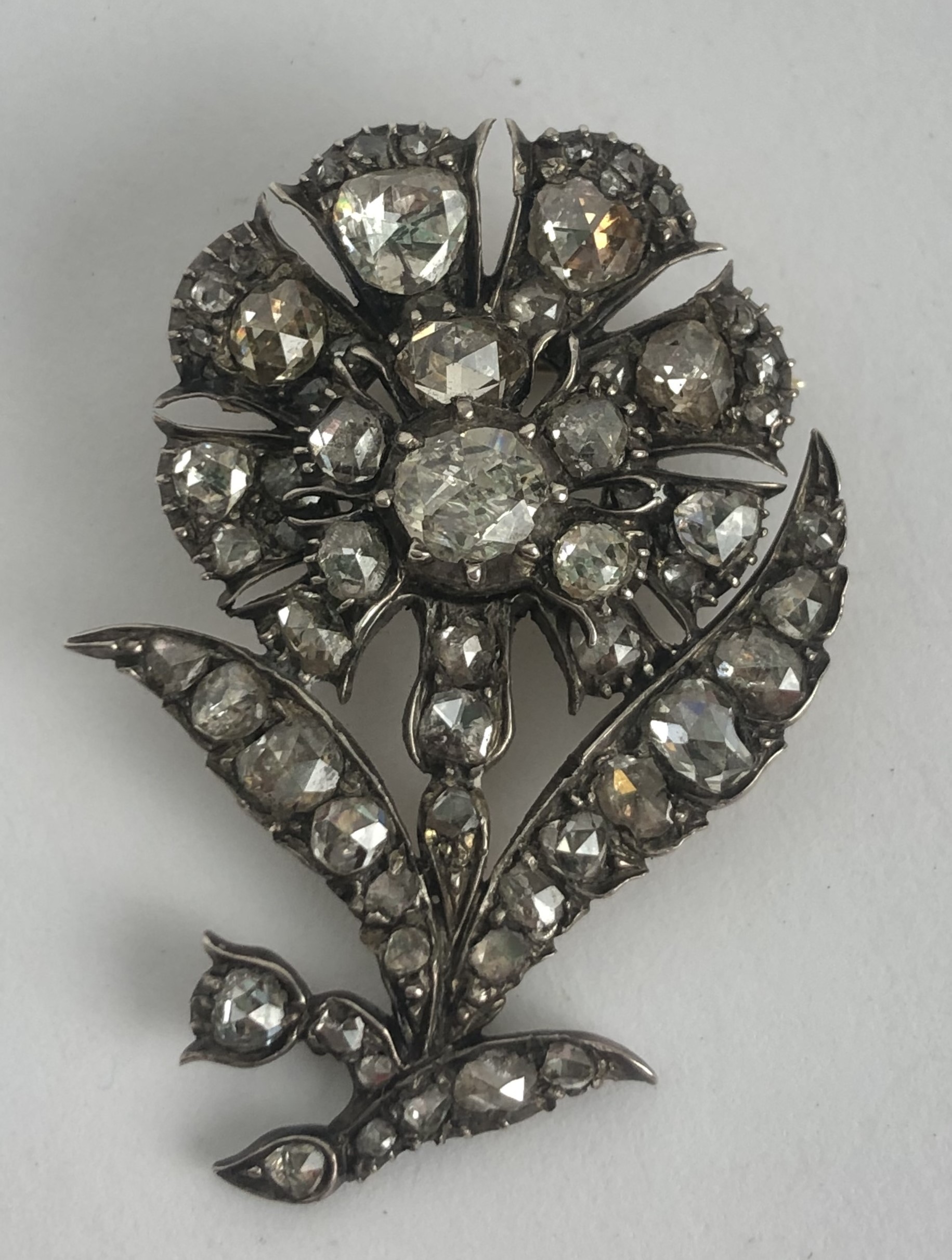 A 19th century diamond brooch, in the form of a flower 4.25 x 3 cm approx. weight: 8.5 g all in