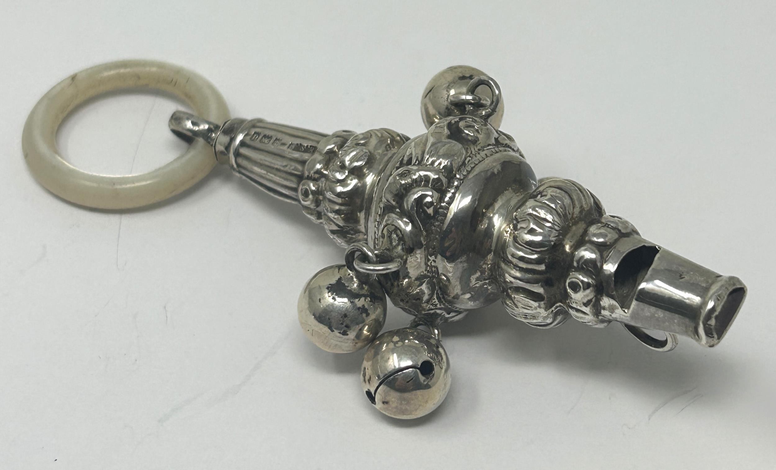 An Edward VII silver and mother of pearl baby's rattle, and a pair of novelty sugar tongs, in the - Bild 2 aus 5