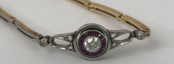 A yellow and white coloured metal bracelet, set rubies and diamonds weight: 8.1 g all in diamond: